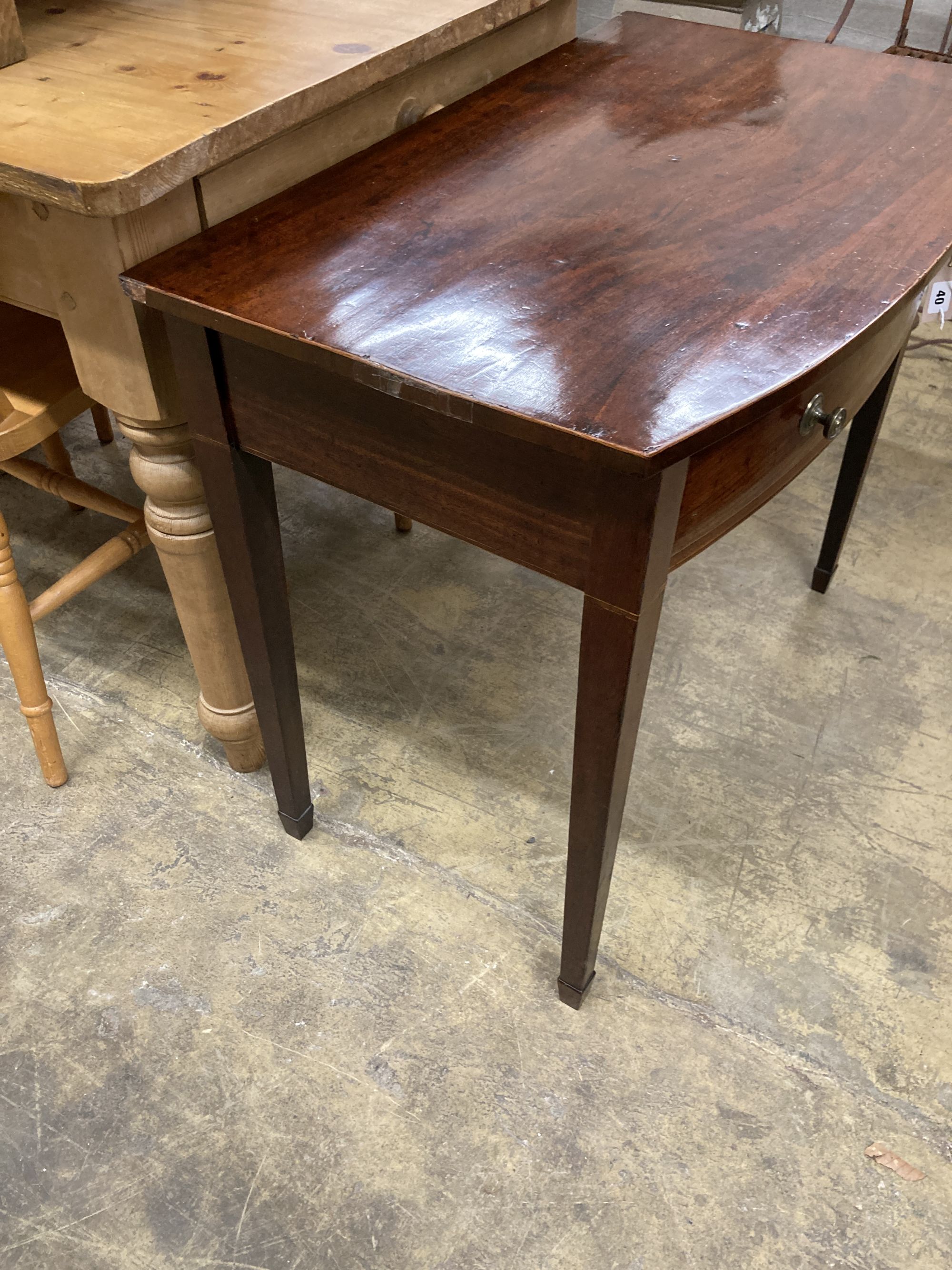 A George III mahogany bow front side table, width 84cm, depth 51cm, height 71cm